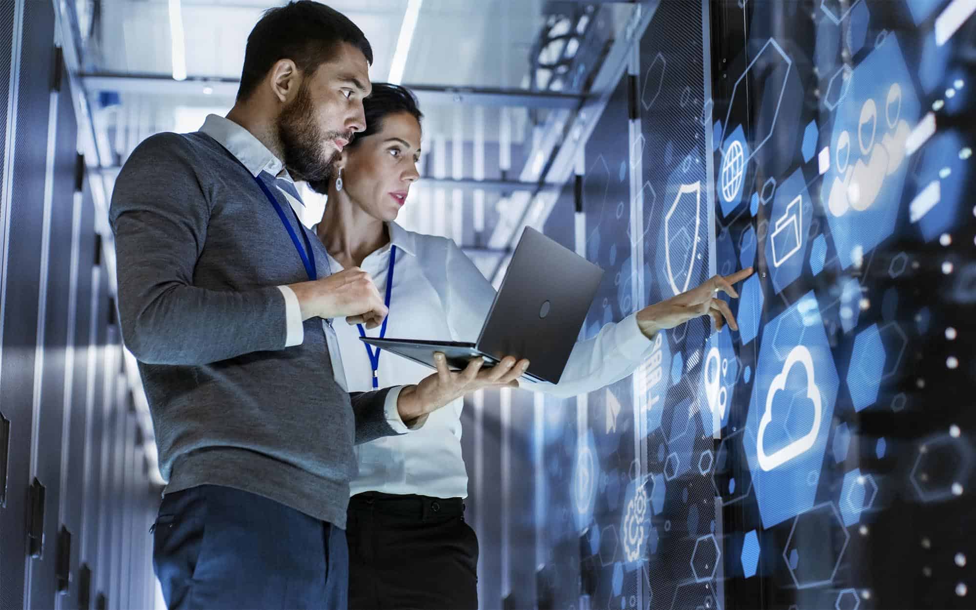 Two-professionals-analyzing-configurations-in-data-center